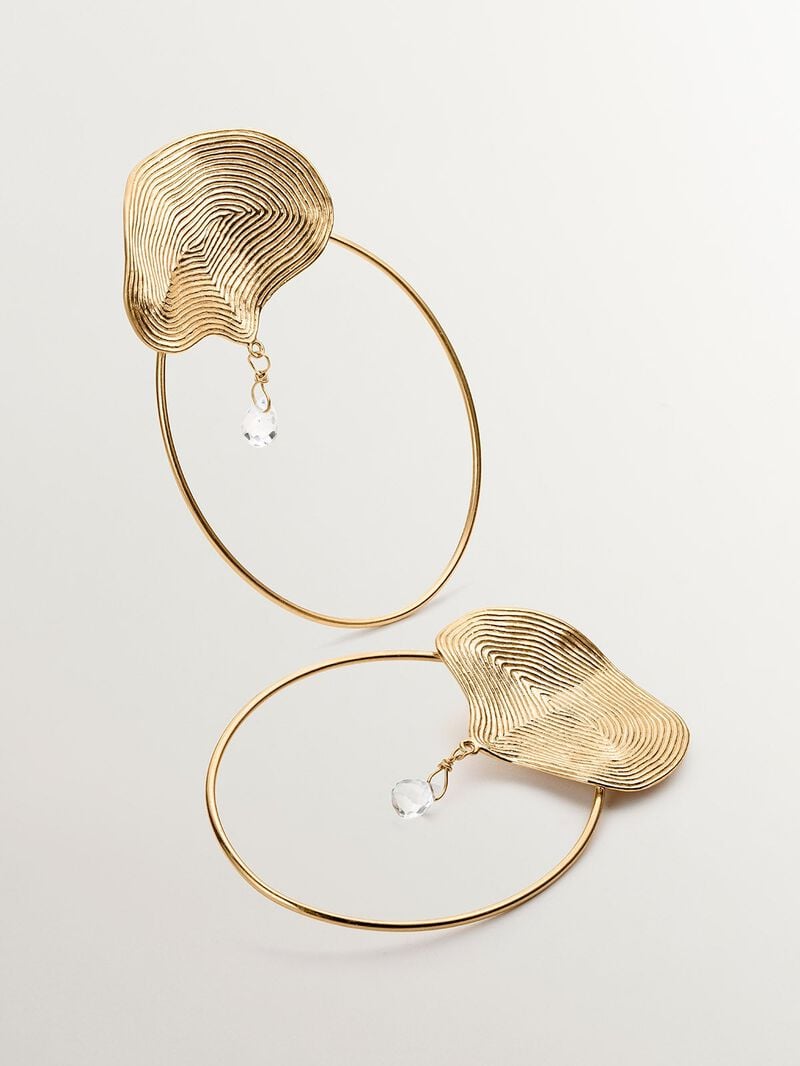 Large hoop earrings made of 925 silver, bathed in 18K yellow gold with embossing and white topaz. image number 2