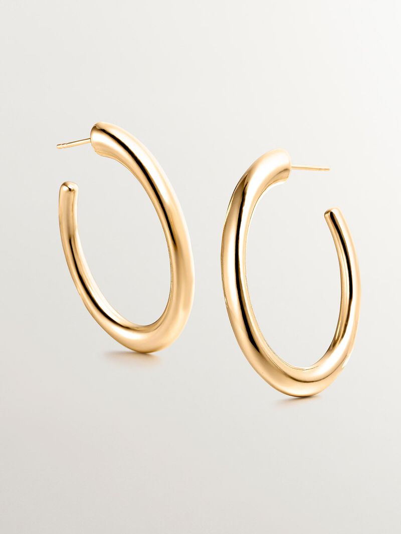 Large hoop earrings made of 925 silver, coated in 18K yellow gold, with an oval shape. image number 4