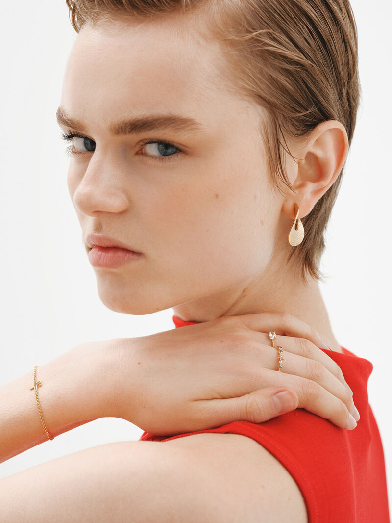 Medium sized hoop earrings made of 925 silver, bathed in 18K yellow gold with texture and irregular shape. image number 5