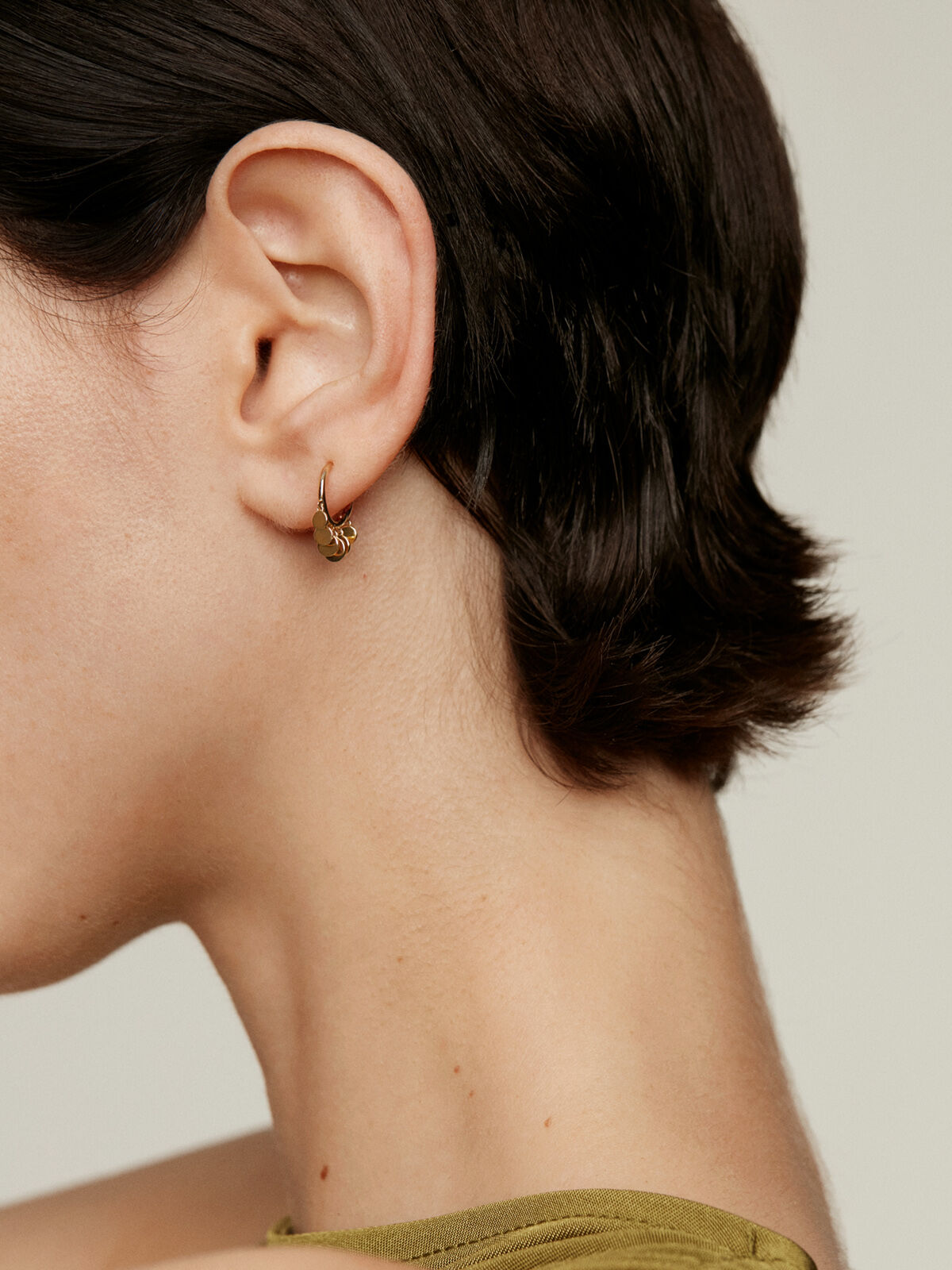Individual 9K yellow gold earring with hanging spheres. Aristocrazy