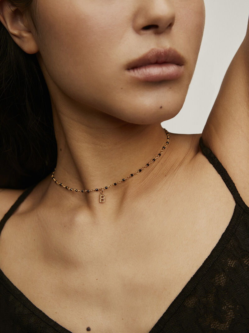 Initial B charm, made of 925 silver coated in 18K yellow gold and adorned with white topaz. image number 1
