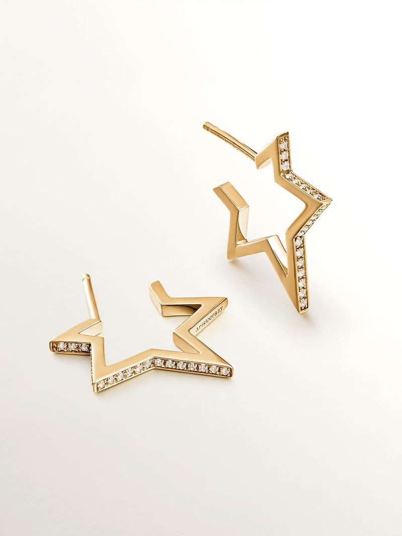 925 Silver earrings bathed in 18K yellow gold in the shape of a star with white topaz. image number 2