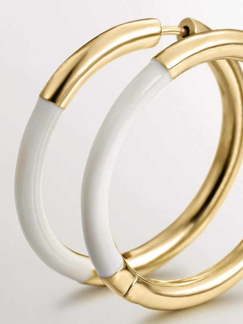 Large hoop earrings made of 925 silver coated in 18K yellow gold with white enamel. image number 4