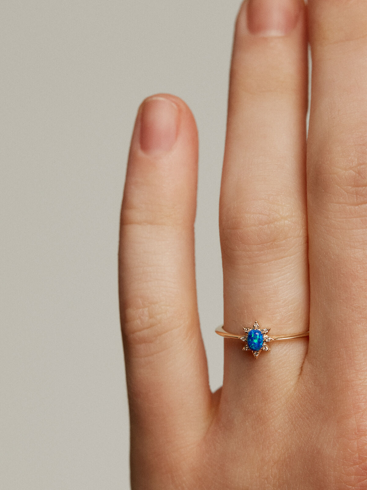 18K yellow gold ring with lab grown blue opal and white diamonds