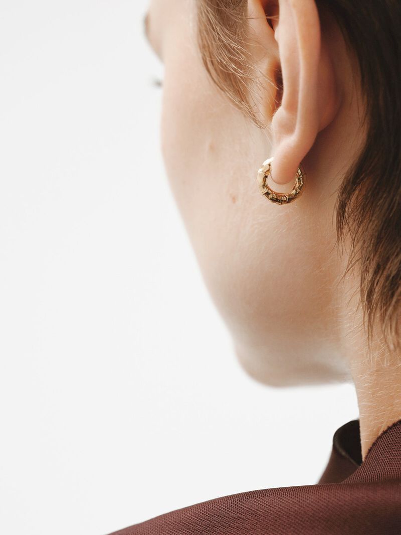 Small hoop earrings made of 925 silver, bathed in 18K yellow gold with a bamboo texture. image number 3
