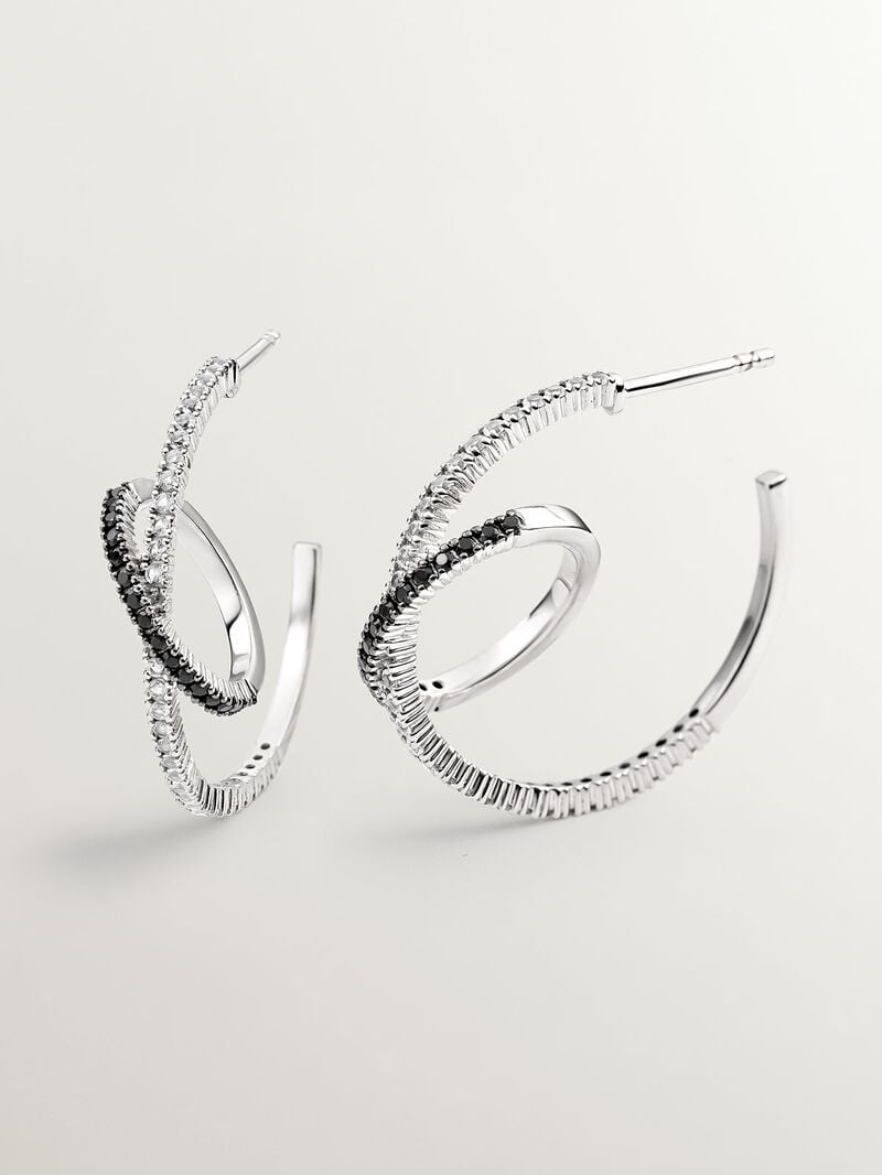 Double hoop earrings made of 925 silver with white topazes and black spinels. image number 0