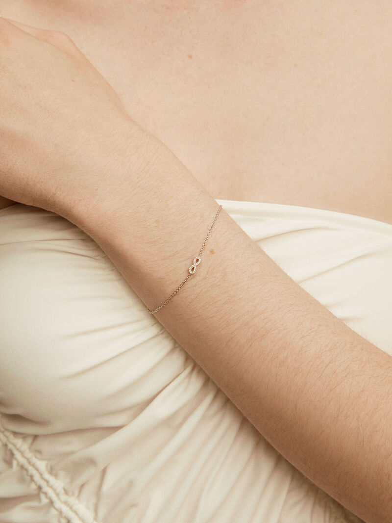 18K white gold bracelet with infinity and diamonds image number 1