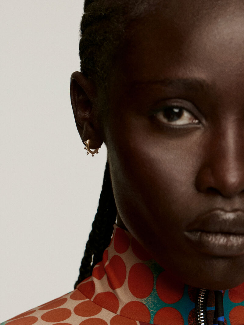 Individual small hoop earring made of 925 silver, bathed in 18K yellow gold with stars. image number 1