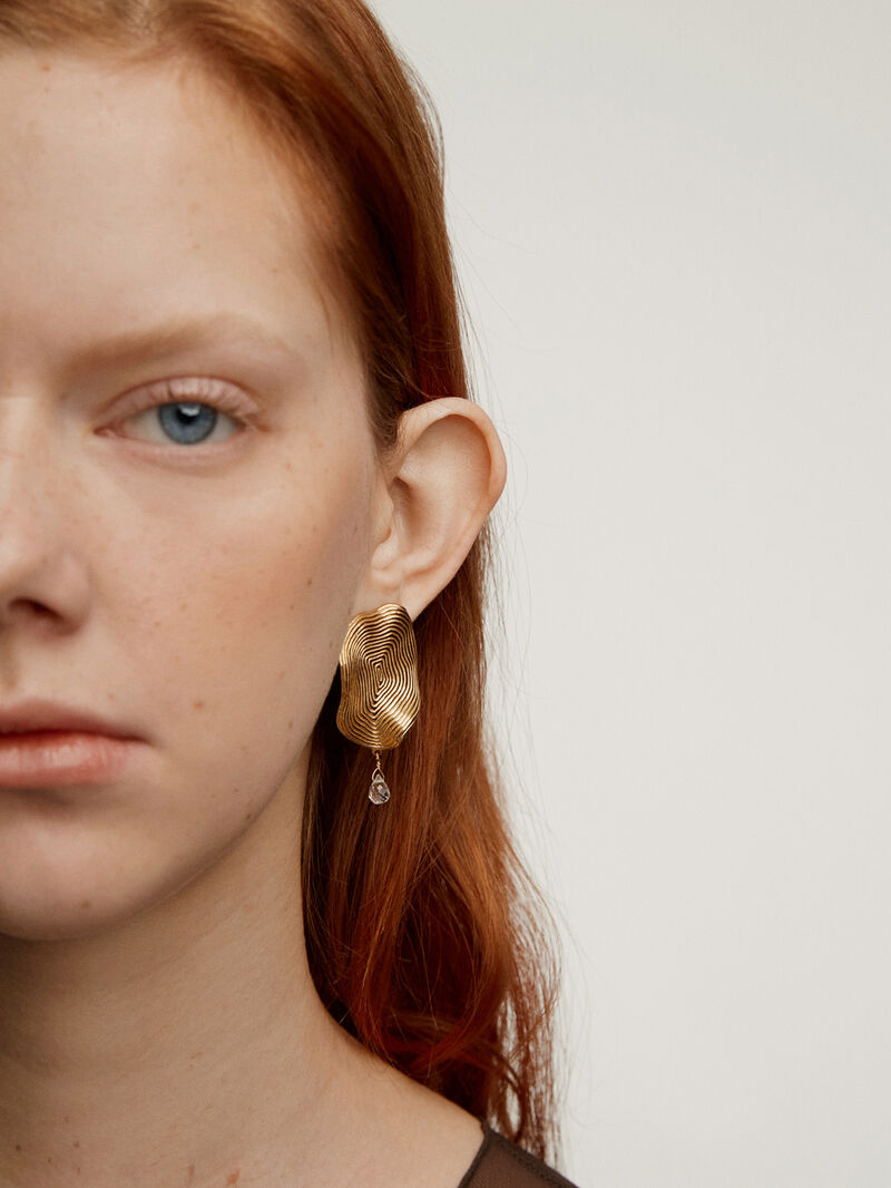 Large wavy earrings made from 925 silver, bathed in 18K yellow gold with white topaz. image number 1