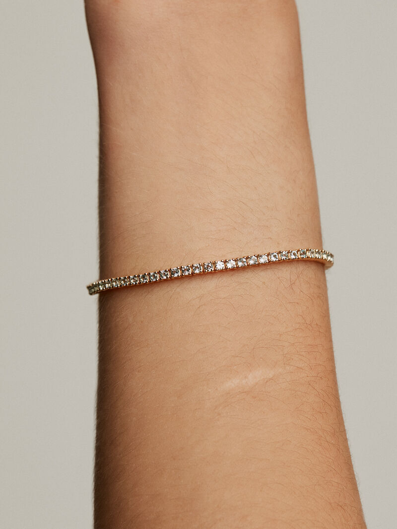 925 Silver bracelet bathed in 18K yellow gold with Swiss blue topaz image number 0
