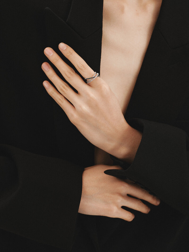Triple crossed ring made of 925 silver plated in 18K yellow gold with white topazes and black spinels. image number 3