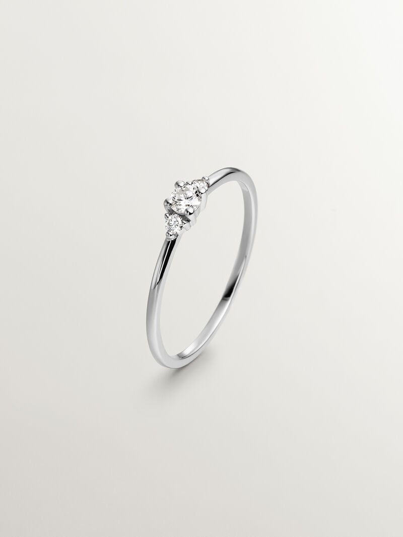 18K white gold trilogy ring with a central diamond of 0.10cts and diamonds image number 0