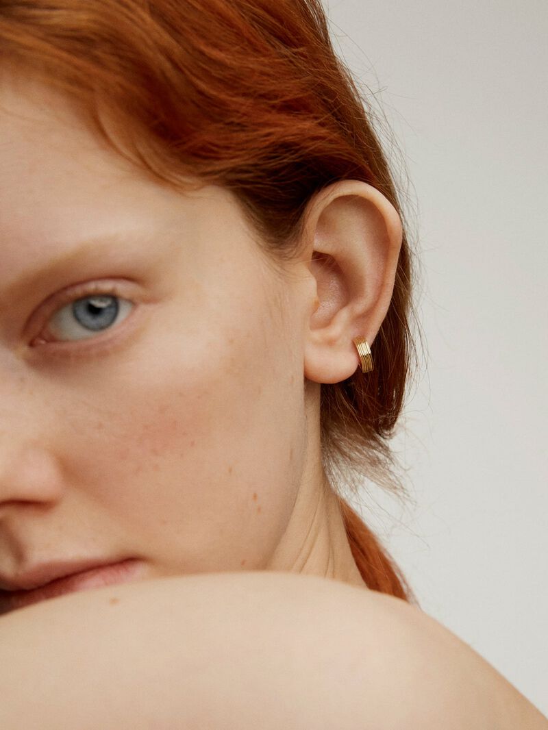 Single wide hoop earring made from 9K yellow gold with texture. image number 3