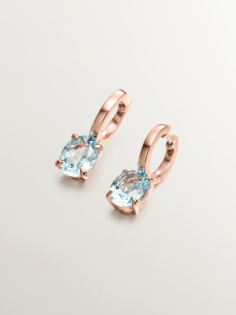 925 Silver earrings plated in 18K rose gold with sky blue topaz. image number 0