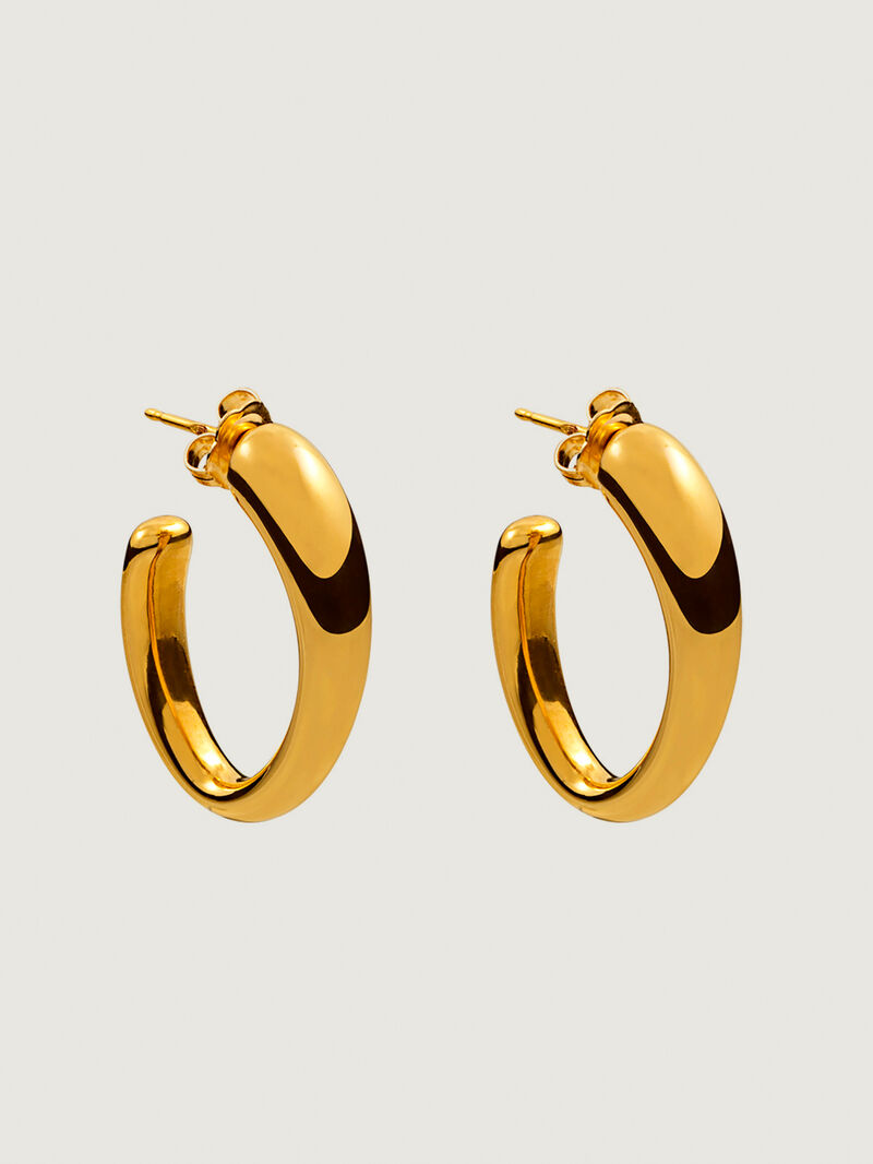 Large and thick hoop earrings made of 925 silver, bathed in 18K yellow gold, with an oval shape. image number 0