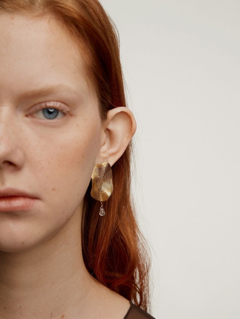 Large wavy earrings made from 925 silver, bathed in 18K yellow gold with white topaz. image number 1
