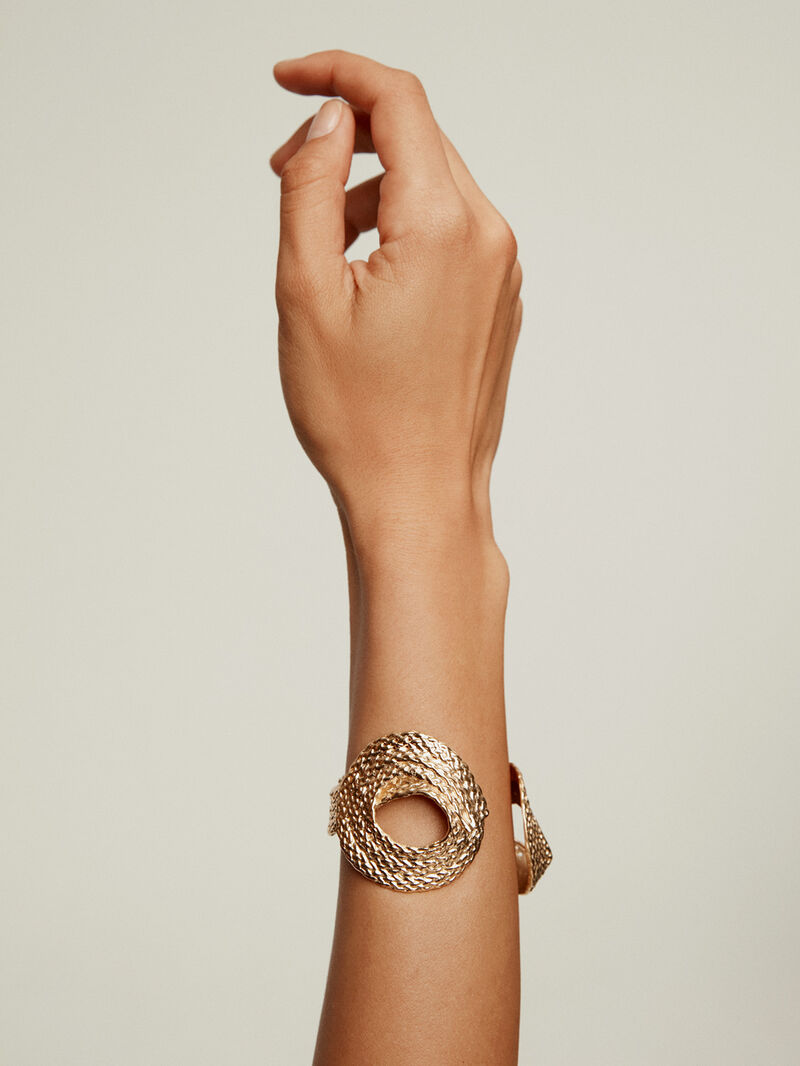 Wide rigid 925 silver bracelet bathed in 18K yellow gold with wicker texture. image number 1