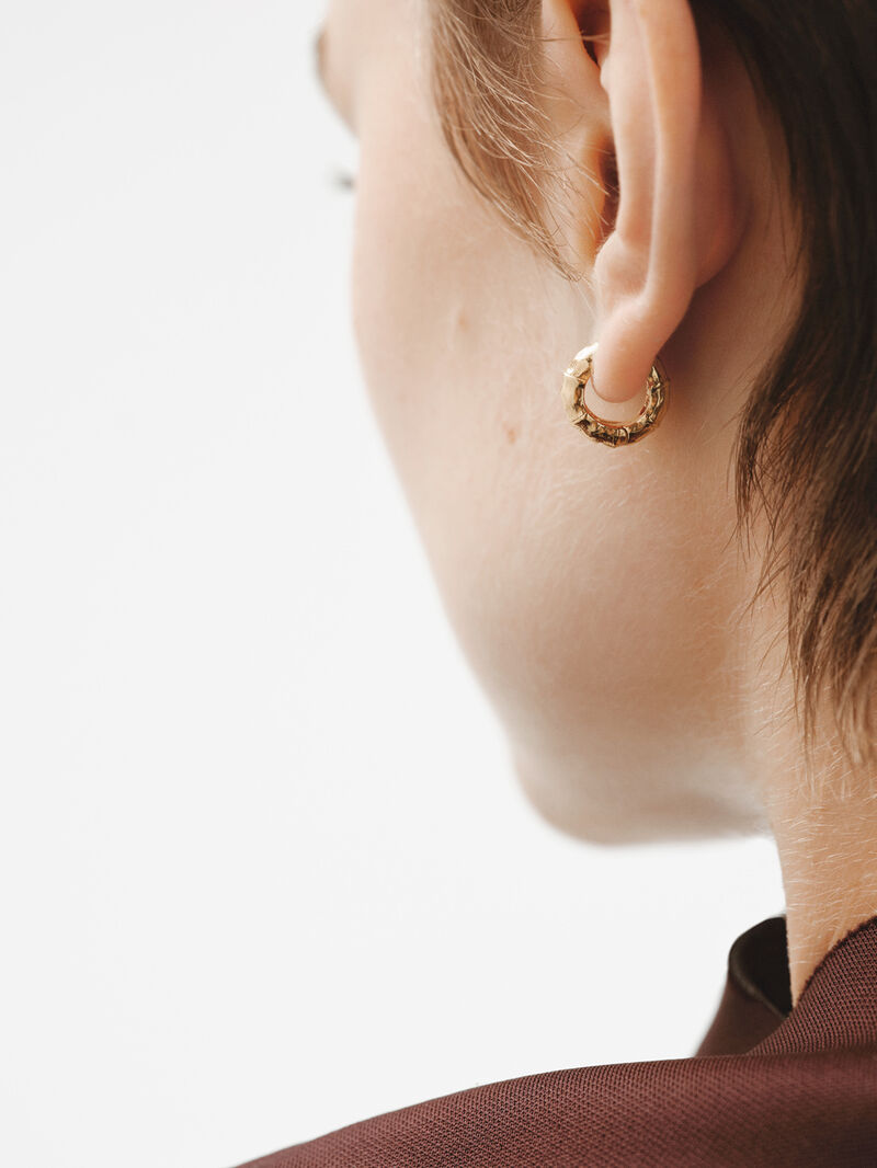 Small hoop earrings made of 925 silver, bathed in 18K yellow gold with a bamboo texture. image number 3