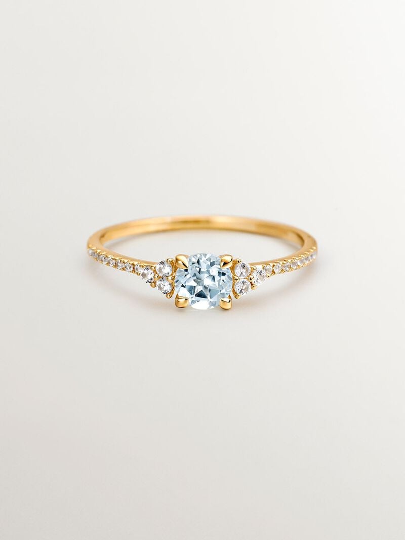 925 Silver ring bathed in 18K yellow gold with sky blue topaz and white sapphires. image number 2