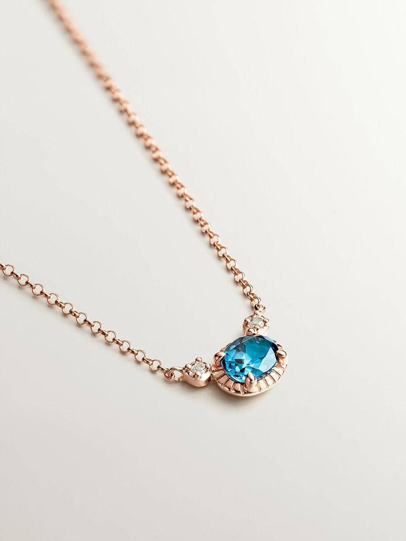 925 Silver pendant dipped in 18K rose gold with London blue and white topazes. image number 1