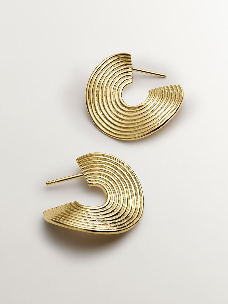 Medium sized hoop earrings made of 925 silver, bathed in 18K yellow gold with texture and irregular shape. image number 4