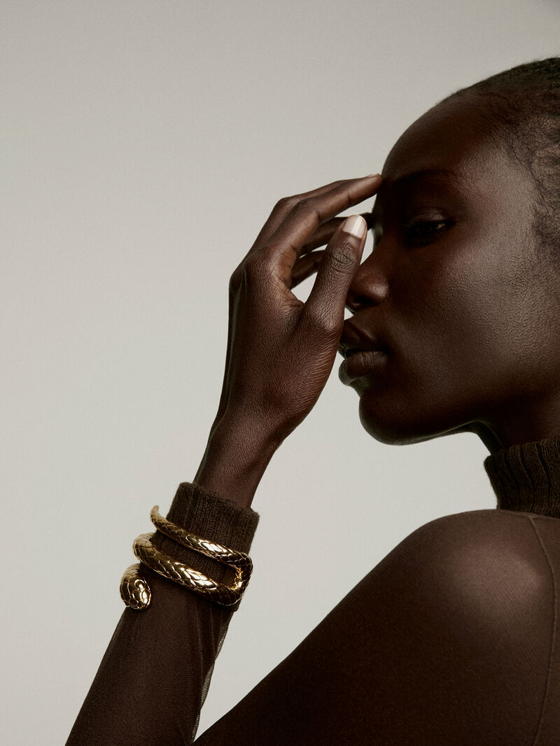 Rigid bracelet made of 925 silver, covered in 18K yellow gold, with a snake shape. image number 1