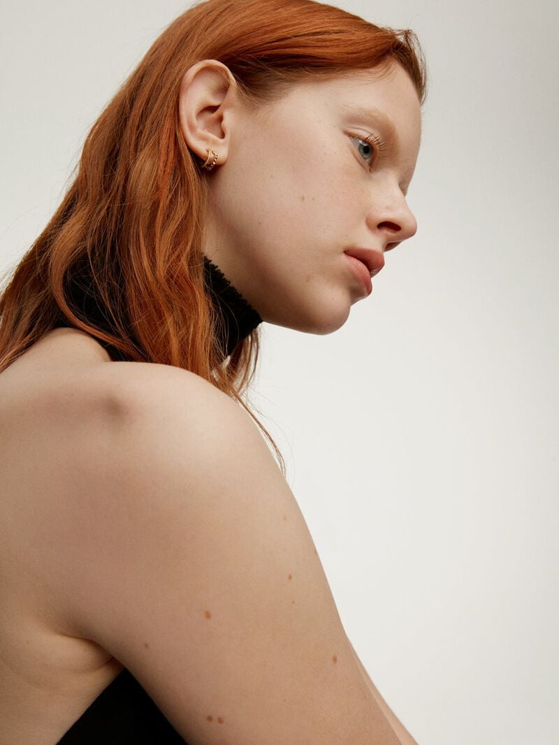 Small double hoop earrings made from 925 silver bathed in 18K yellow gold with embossing and white topazes. image number 3