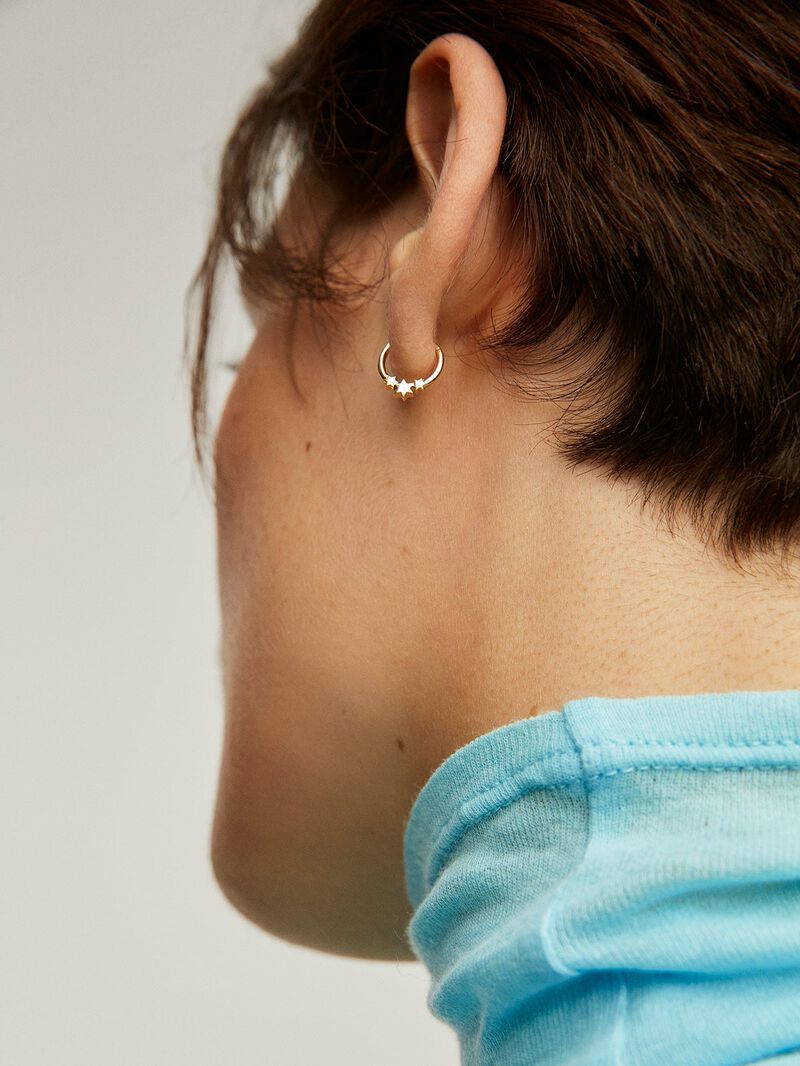 Small 9K yellow gold hoop earring with stars. image number 1