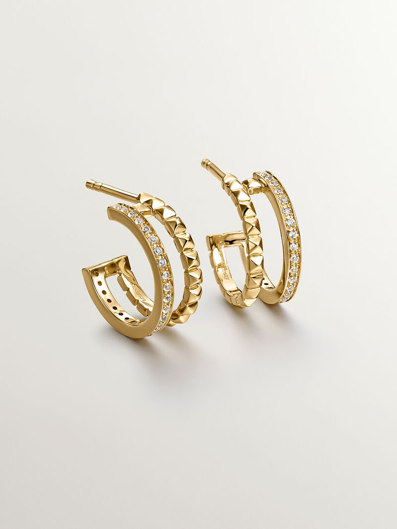 Double hoop earrings made of 925 silver plated in 18K yellow gold with embossing and white topaz. image number 4