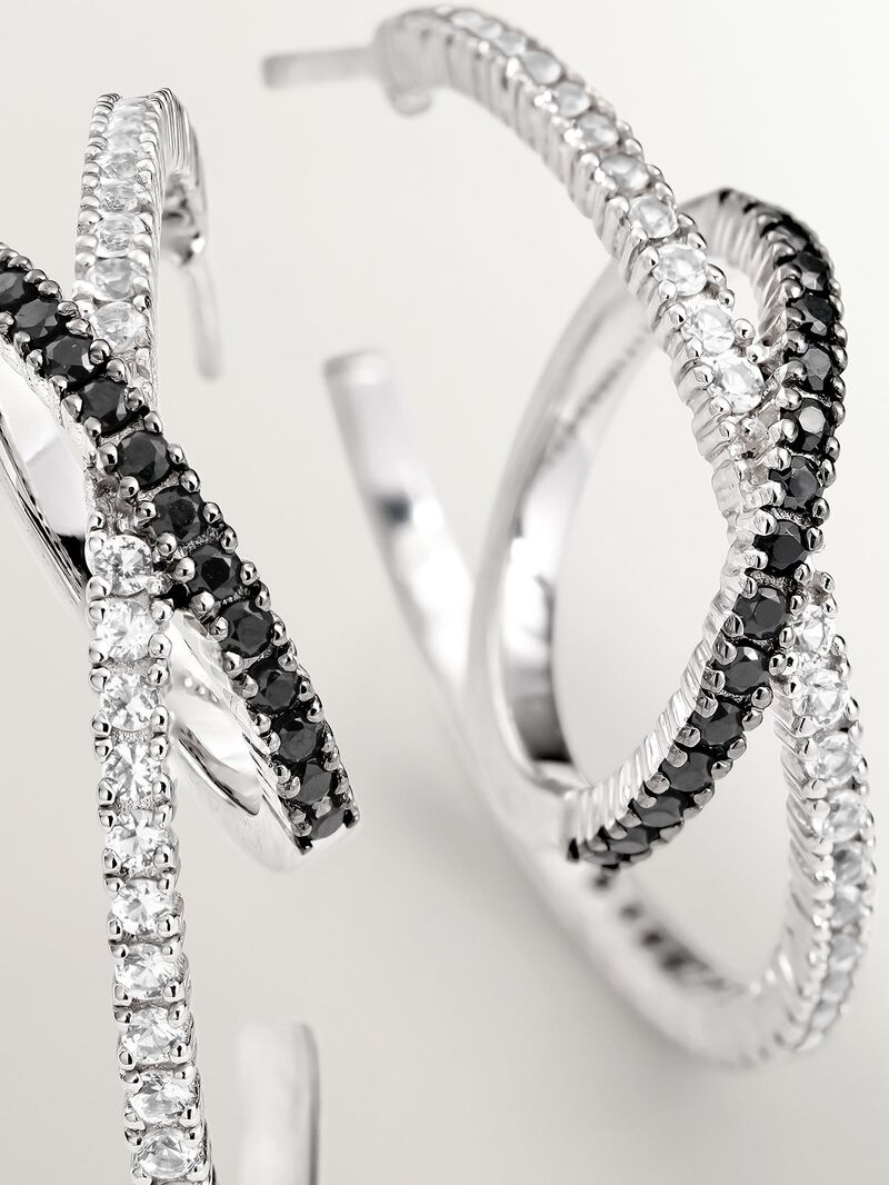 Double hoop earrings made of 925 silver with white topazes and black spinels. image number 4