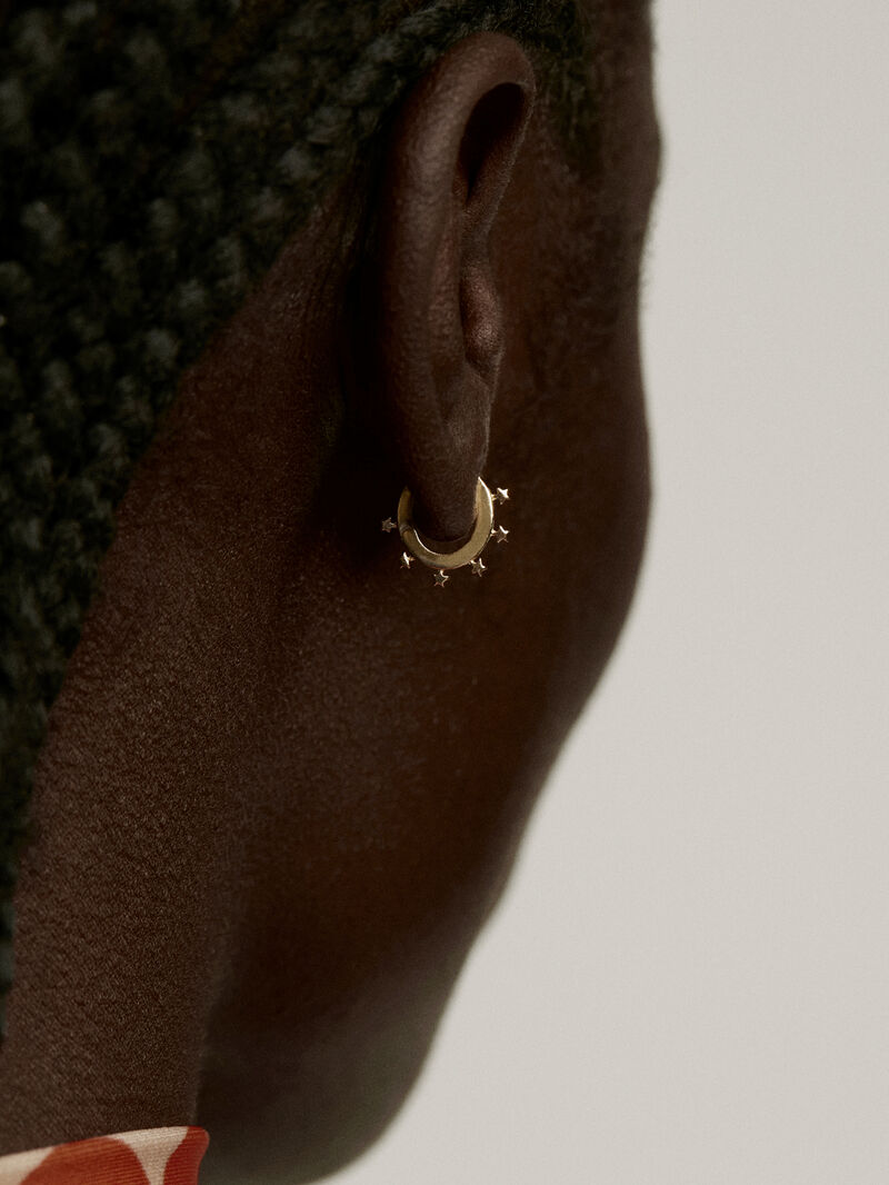Individual small hoop earring made of 925 silver, bathed in 18K yellow gold with stars. image number 3