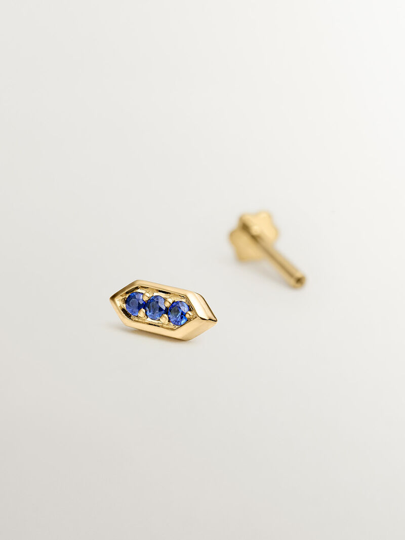 Hexagonal piercing of 18k yellow gold with blue sapphires image number 4