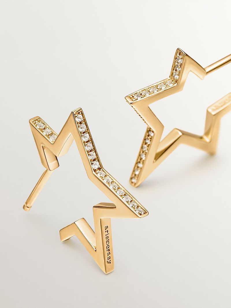 925 Silver earrings bathed in 18K yellow gold in the shape of a star with white topaz. image number 4