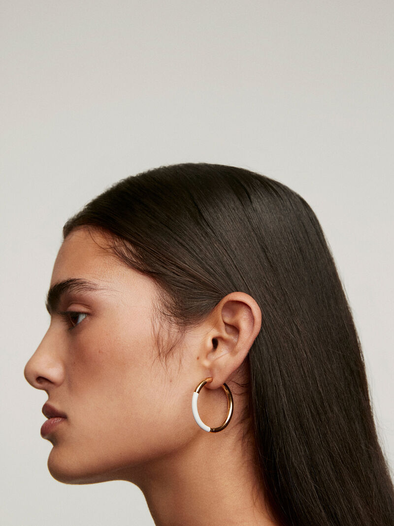 Large hoop earrings made of 925 silver coated in 18K yellow gold with white enamel. image number 3