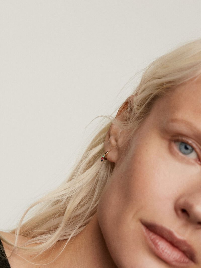 Individual hoop earring with emerald, ruby, and sapphire. image number 1