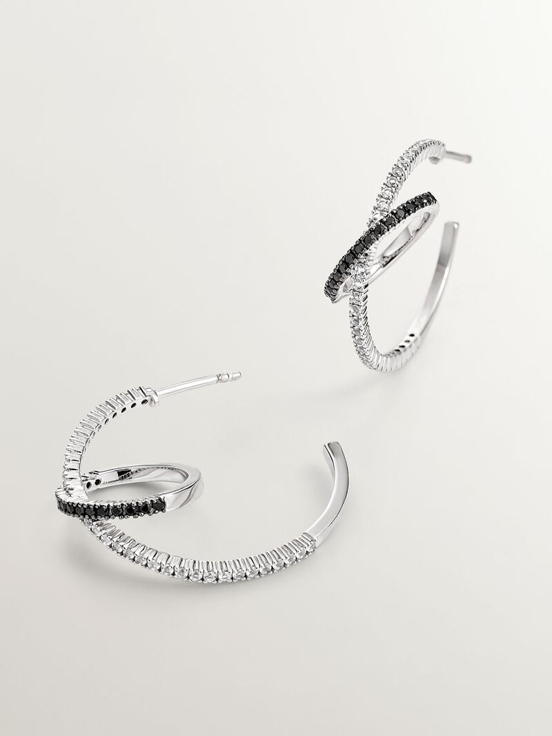 Double hoop earrings made of 925 silver with white topazes and black spinels. image number 2