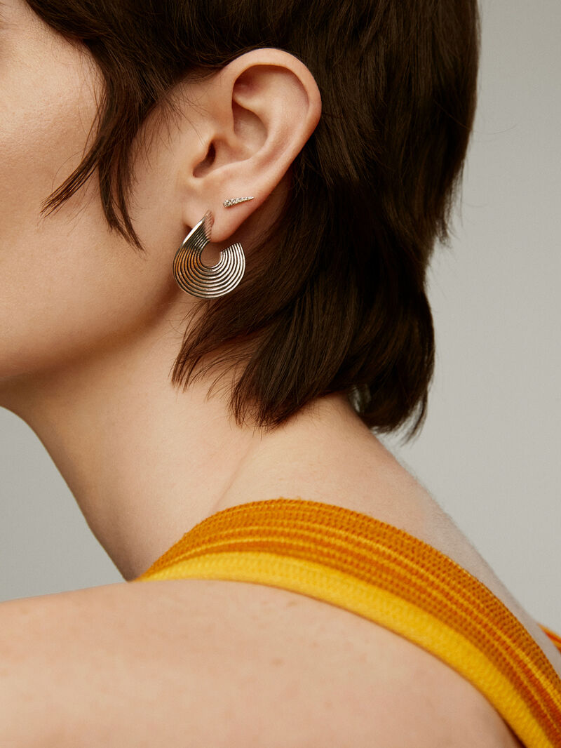 Medium-sized 925 silver hoop earrings with embossed and irregular shape image number 5