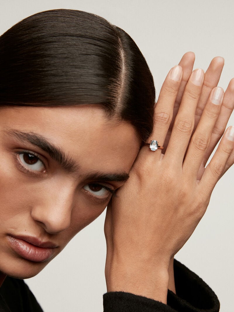 Medium-sized 925 silver hoop earrings plated in 18K rose gold with sky blue topaz. image number 1
