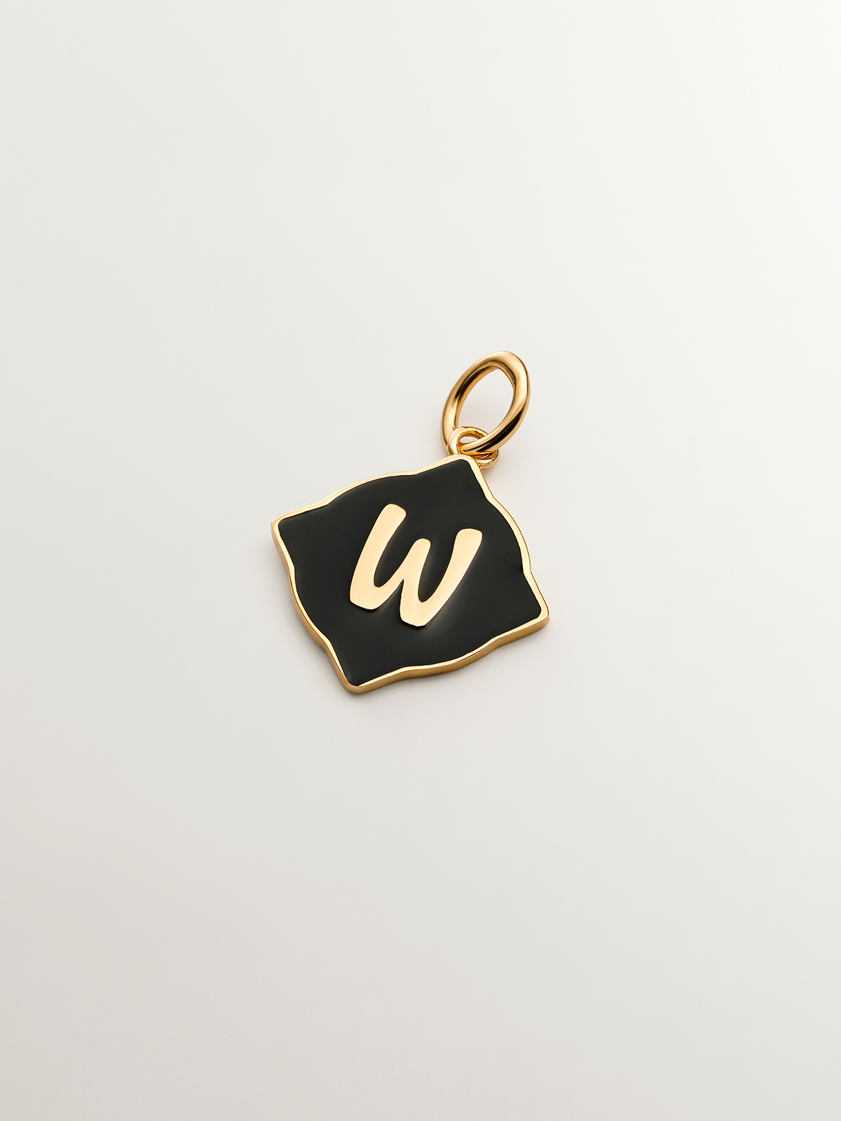 18K yellow gold plated 925 sterling silver charm with W initial and black enamel with irregular diamond shape