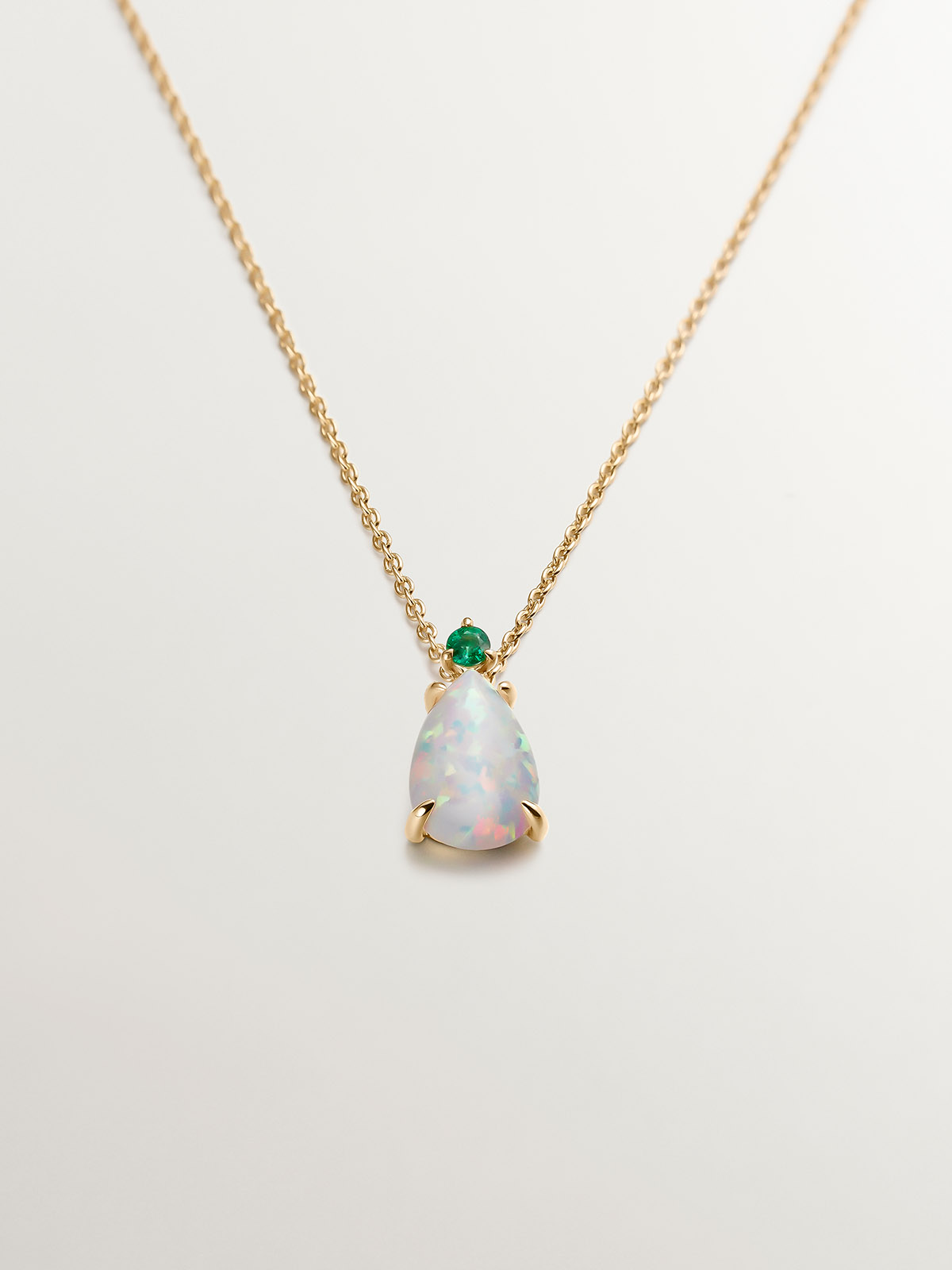 18K yellow gold necklace with white opal and emerald.