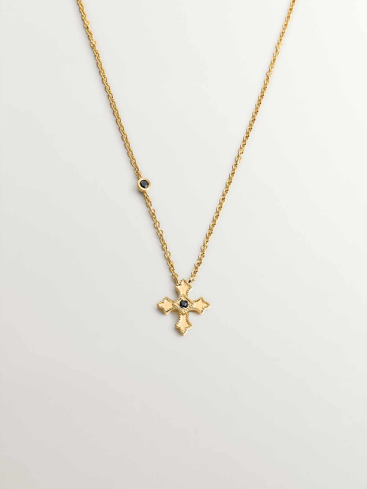 925 Silver pendant dipped in 18K yellow gold with small cross and spinels.