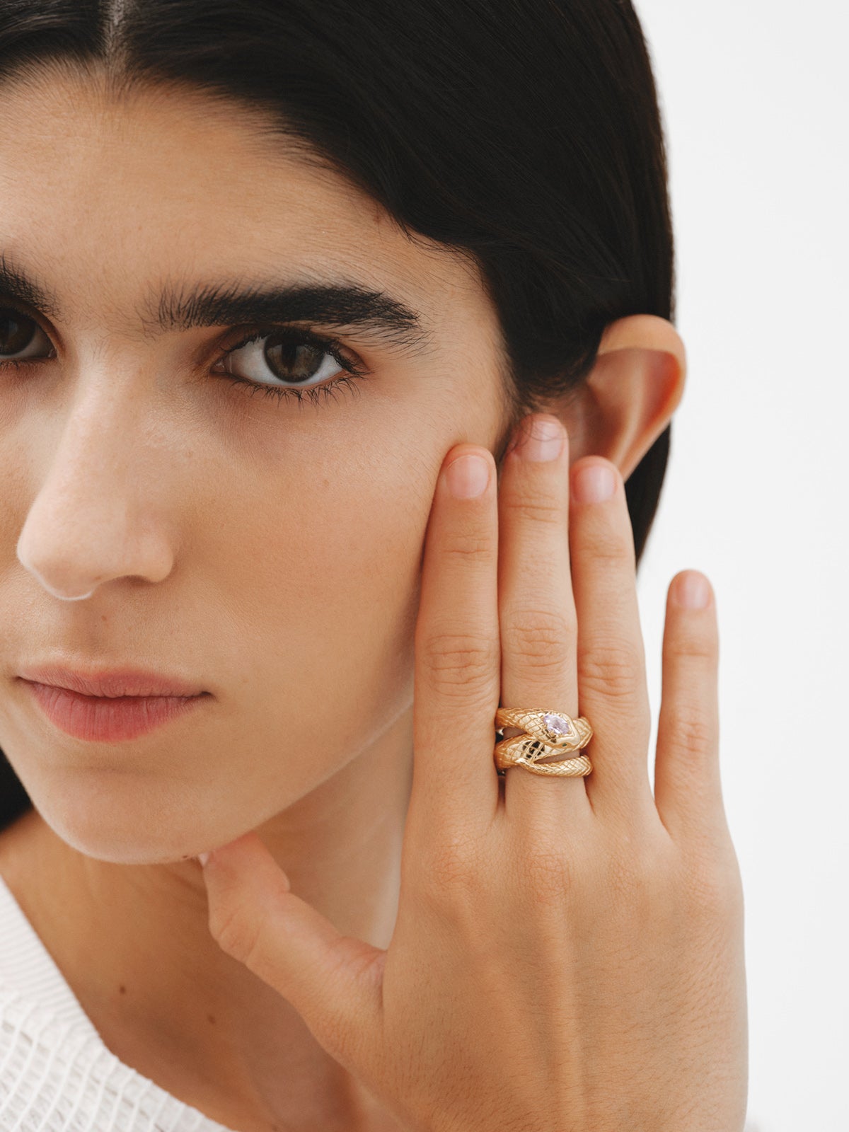 Wide 925 silver ring bathed in 18K yellow gold with a snake shape, purple amethyst and green tsavorites.