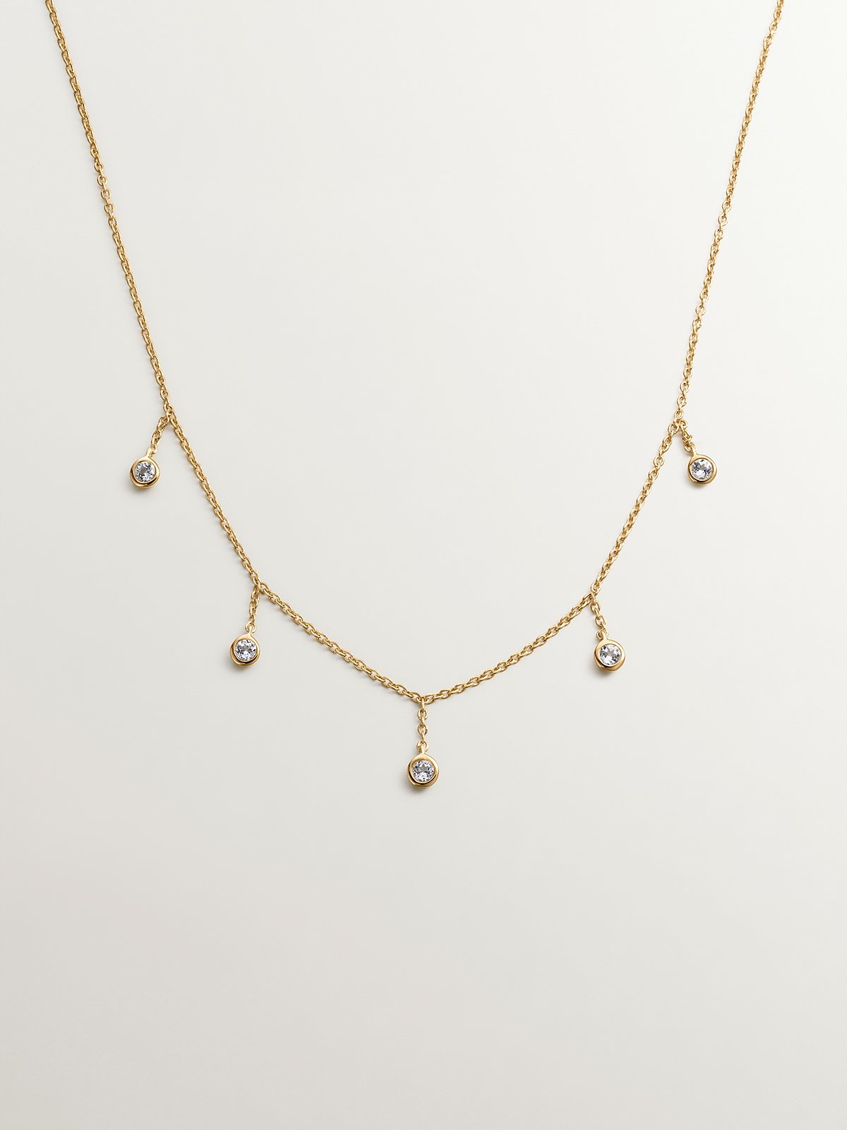 925 silver necklace bathed in 18K yellow gold with white topaz stones