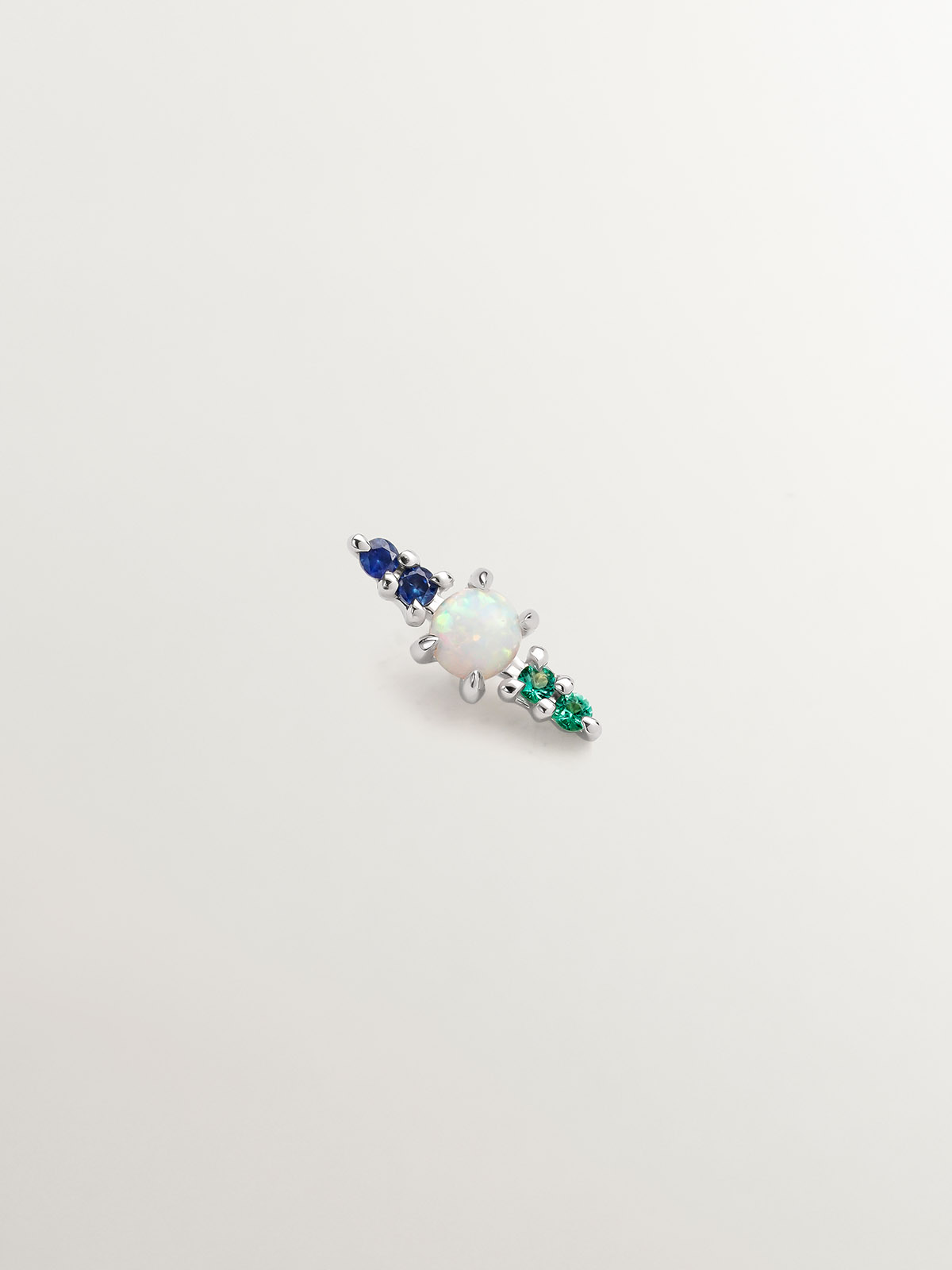 Individual 18K white gold earring with lab grown turquoise opal, blue sapphires and emeralds.
