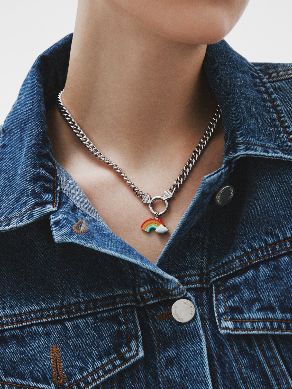925 silver charm shaped like a rainbow and multicolored enamel