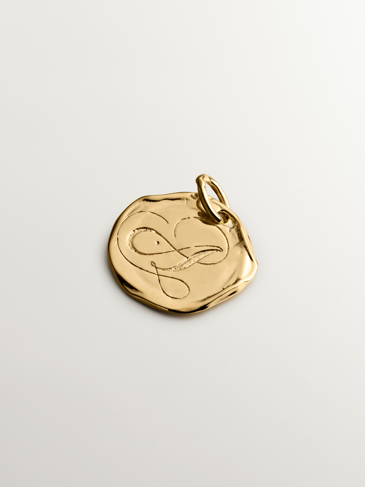 Handcrafted 925 silver charm bathed in 18K yellow gold with initial A.