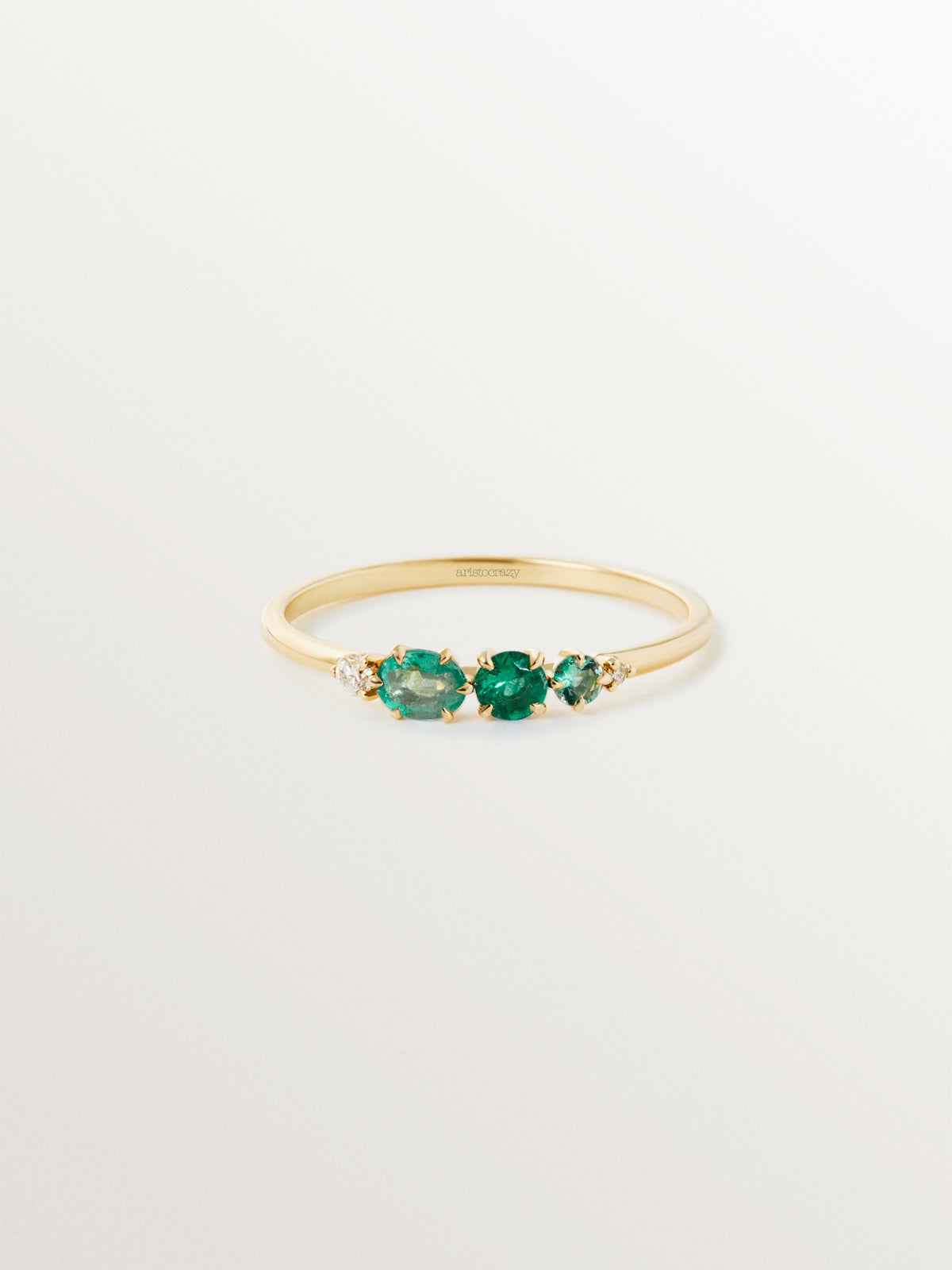 9K yellow gold ring with emeralds and diamonds