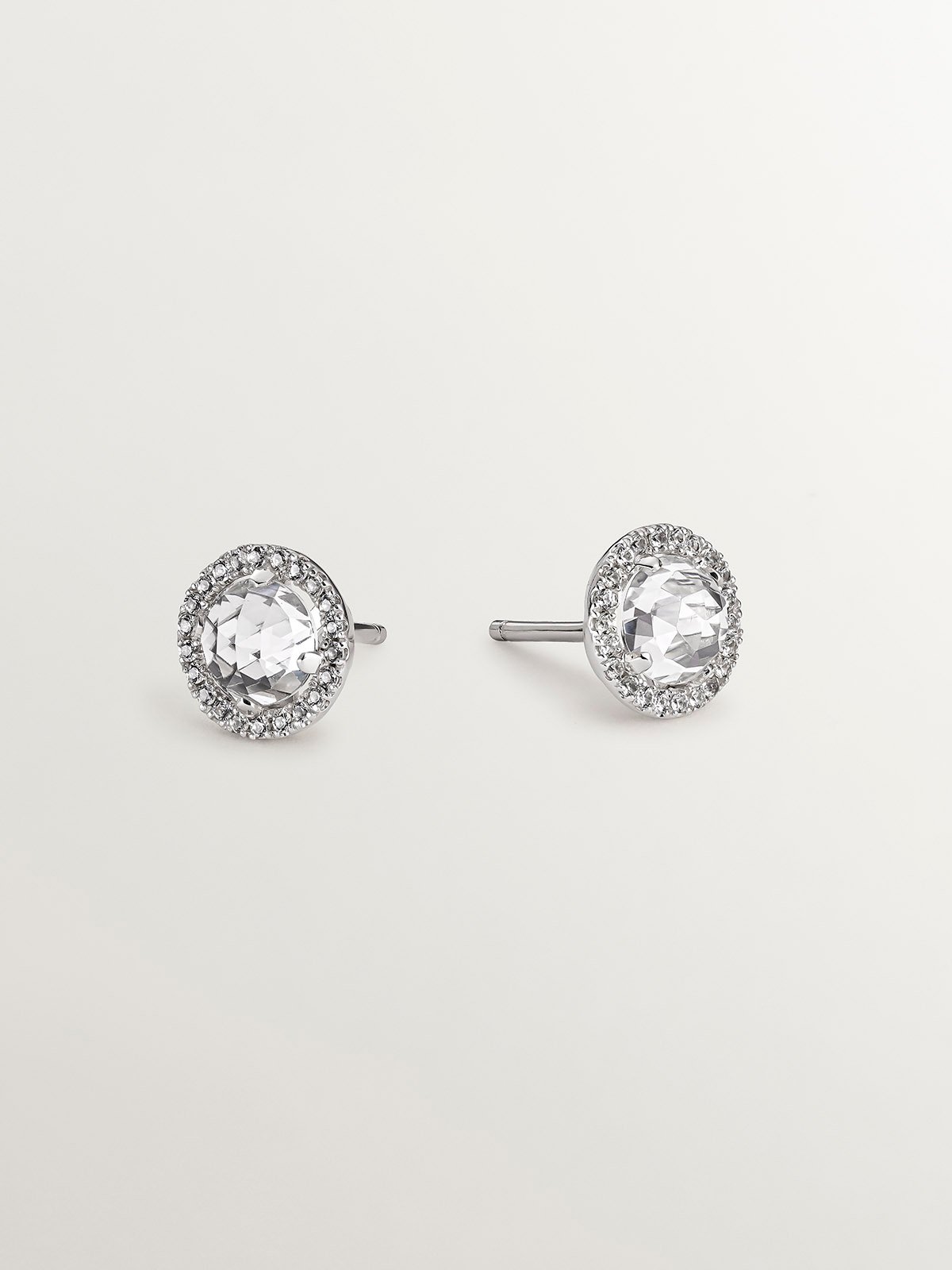 925 silver button earrings with white topaz and a halo of white sapphires.