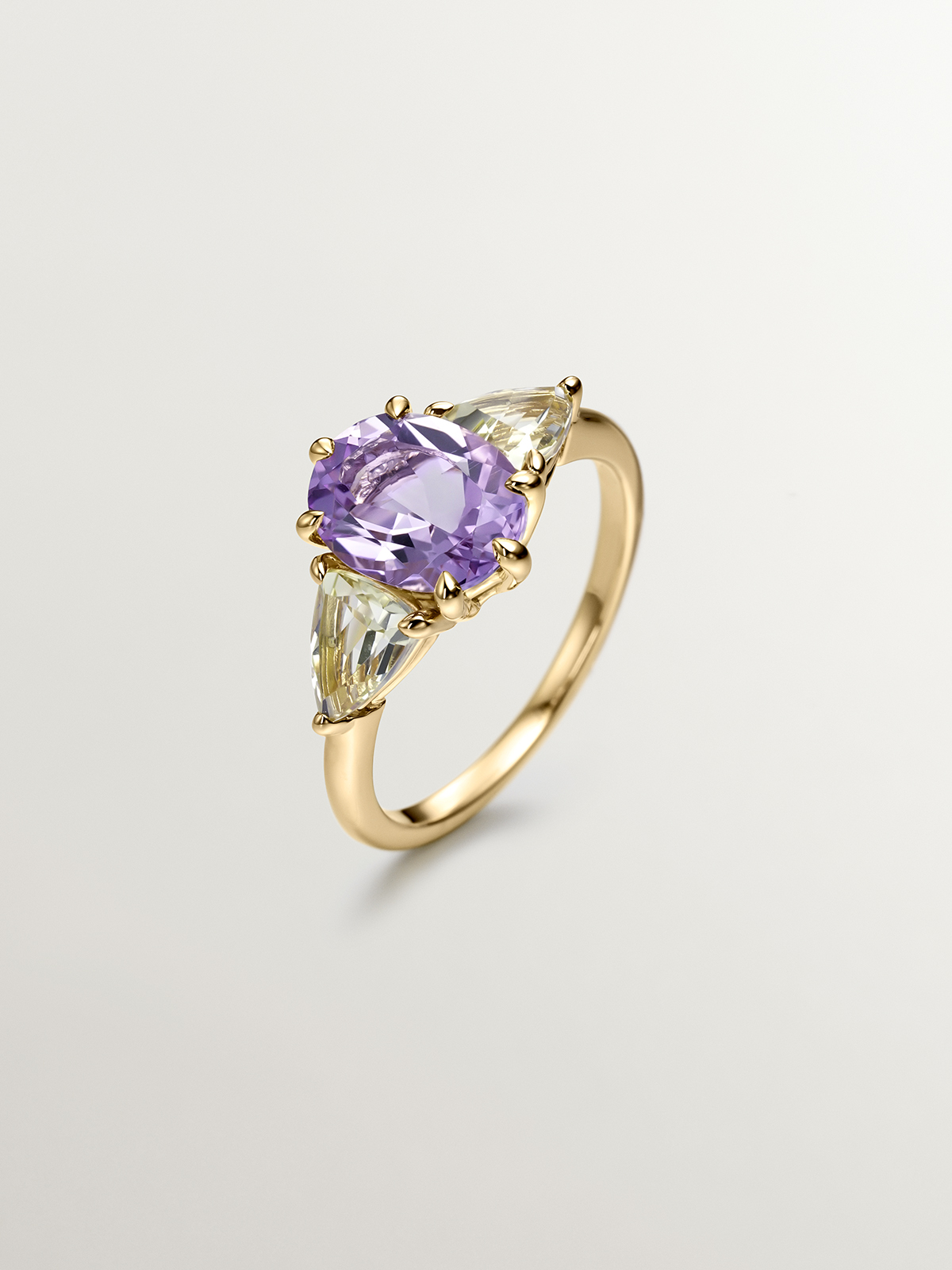 925 Silver trio ring bathed in 18K yellow gold with purple amethyst and yellow quartz.