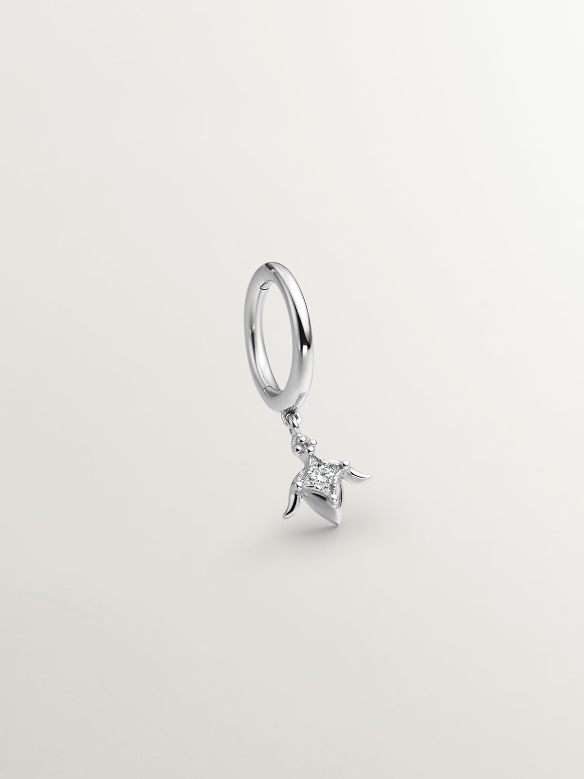 Individual small hoop earring in 9K white gold with diamond and lotus flower.